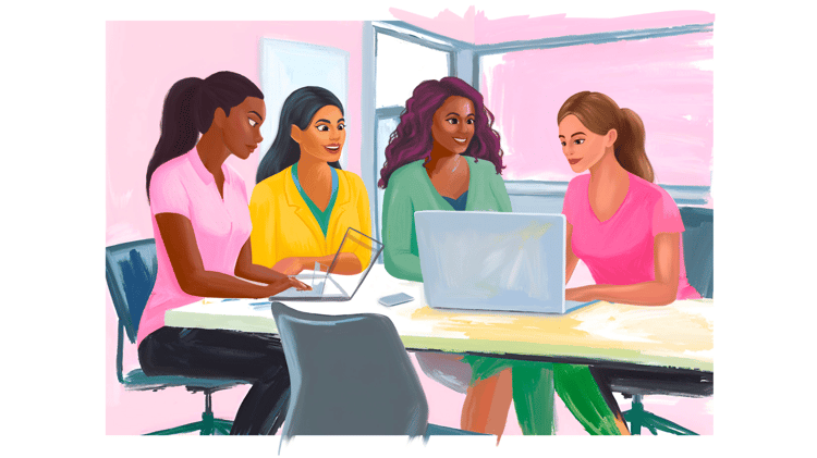 Women of various ethnic backgrounds, wearing pink, yellow, green and blue, holding a meeting while seated at a table working on a laptop.