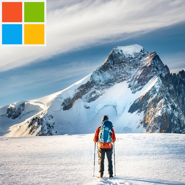 A calendar with blue pins in four days with the Microsoft logo to the top left corner.