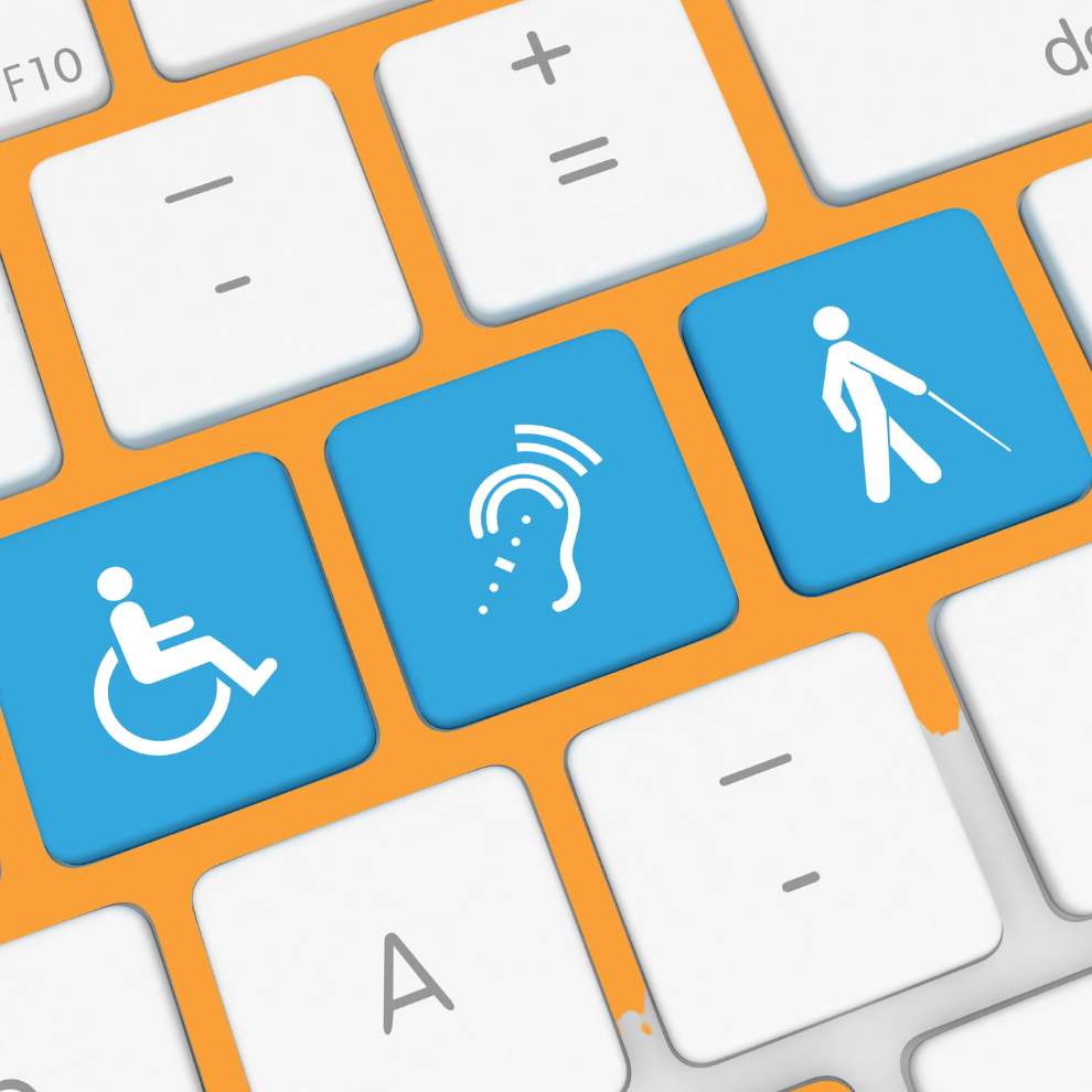 A close up of a white laptop keyboard showing three blue buttons with disability icons on them.