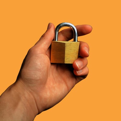A metallic image of a circuit board with a lock icon in the center